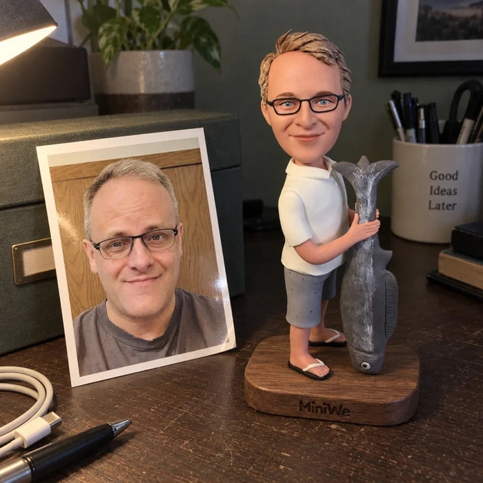 A fishing figurine and printed photo