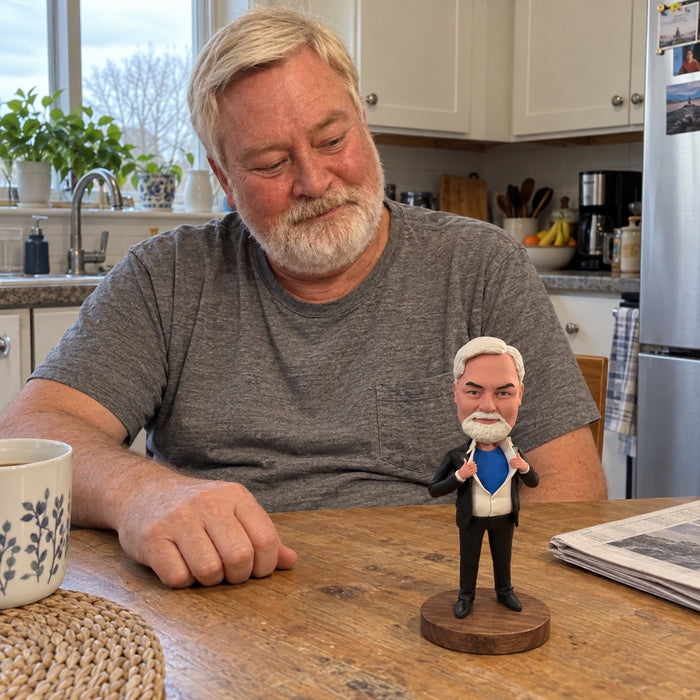 An older adult looking at a figurine on an everyday kitchen table.